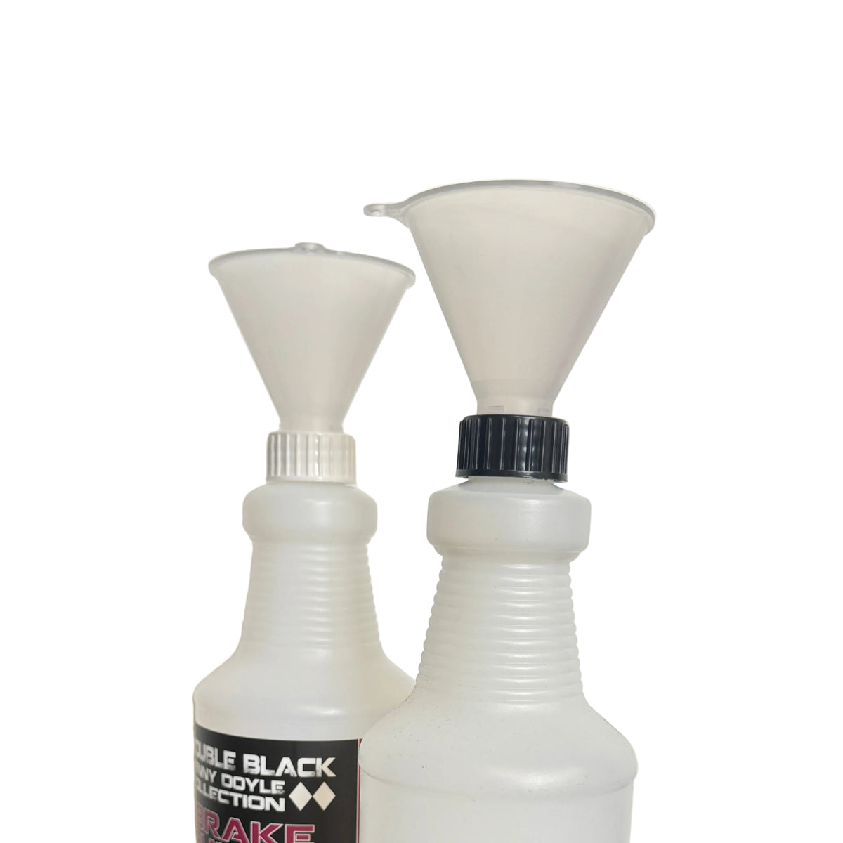 Two white plastic spray bottles with funnel tops on a black surface against a white wall. One bottle has a black label reading 'WATER BLACK COATED SPRAY' and the other is plain white with a black cap.