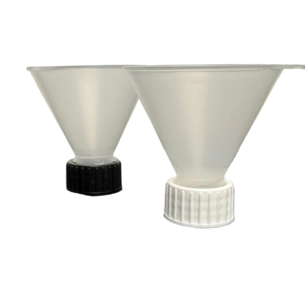 Two translucent plastic funnel-shaped pieces, one attached to a black ribbed cap and the other to a white ribbed cap, displayed on a dark surface against a light background.