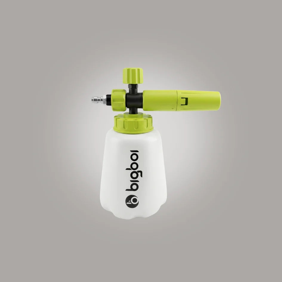 A Bigboi foam cannon attachment with a translucent white foam tank, lime green nozzle and knobs, and black accents, shown against a neutral gray background.